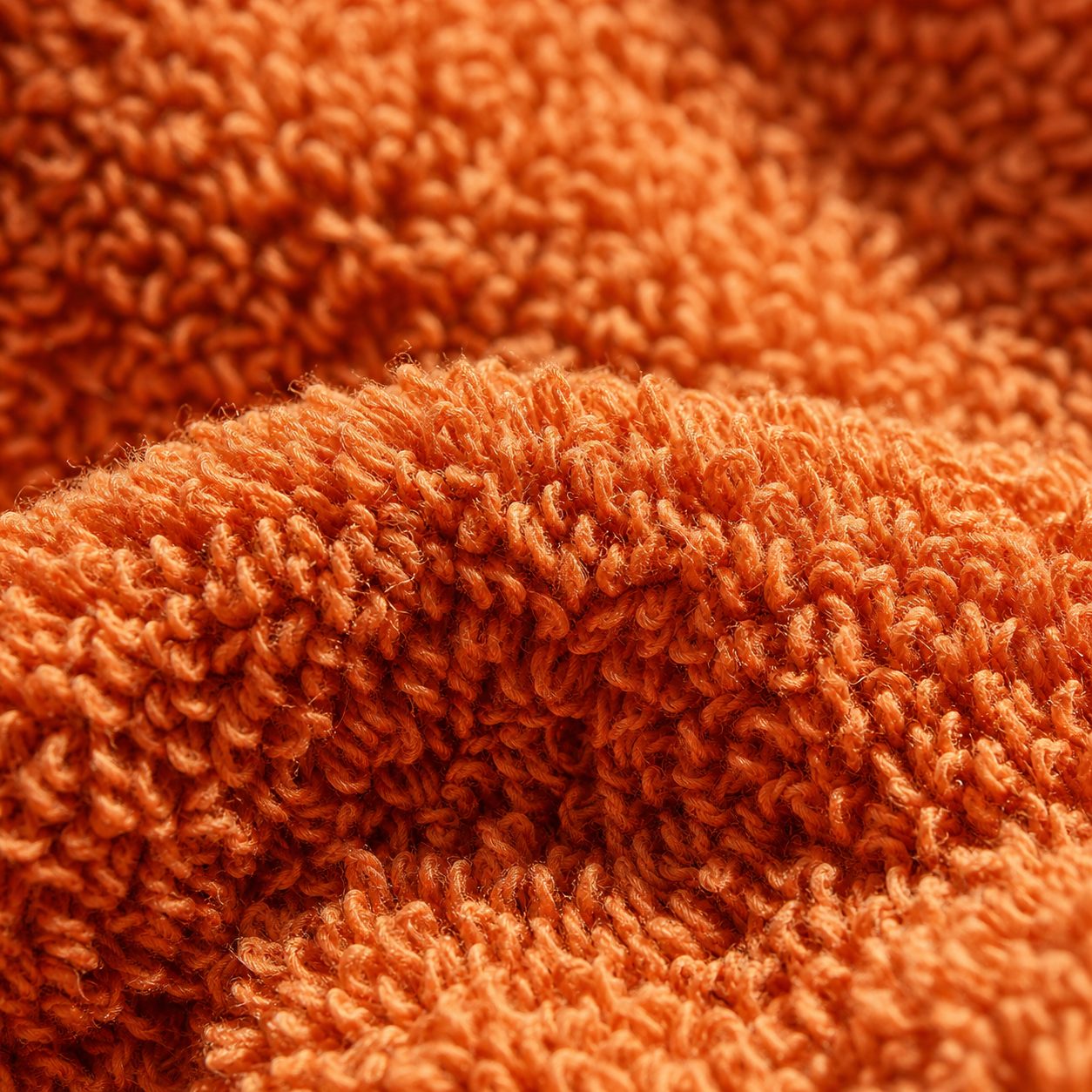 Macro of terry towel loop pile in terracotta cotton
